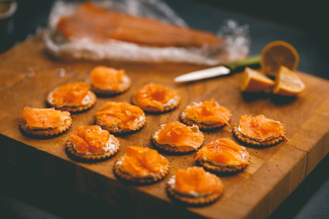 Plating an order of smoked salmon at the counter